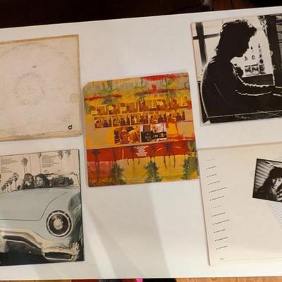 Sale Photo Thumbnail #186: A mixed-era collection of classic singer-songwriter LPs ranging from introspective 70s rock to polished 80s new wave. Condition ranges from fair to good; jackets show age and wear typical of home-stored collections. Great set for collectors, DJs, décor, 