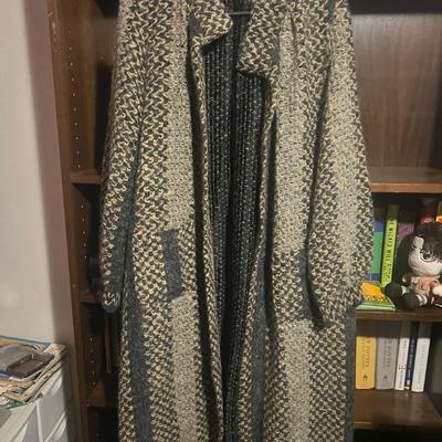 Sale Photo Thumbnail #201: Material: 55% Mohair, 35% Orlon Acrylic, 10% Polyester
Condition: Excellent

Description:
Vintage 1980s long mohair-blend sweater coat from All That Jazz – Seattle. Chunky knit with charcoal, cream, and tan tones, oversized draped front, and knit pocket