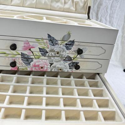 Sale Photo Thumbnail #226: Thomas Pacomi designer, 15X11 with 4 drawers and a lift off lid. Very heavy , with hand painted floral design in good condition. The drawers are divided for all kinds of jewelry. There is one repair photoed, to the edge of one of the drawers.