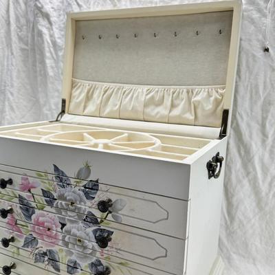 Sale Photo Thumbnail #229: Thomas Pacomi designer, 15X11 with 4 drawers and a lift off lid. Very heavy , with hand painted floral design in good condition. The drawers are divided for all kinds of jewelry. There is one repair photoed, to the edge of one of the drawers.