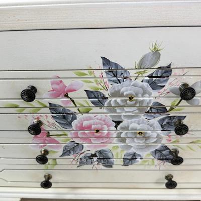 Sale Photo Thumbnail #222: Thomas Pacomi designer, 15X11 with 4 drawers and a lift off lid. Very heavy , with hand painted floral design in good condition. The drawers are divided for all kinds of jewelry. There is one repair photoed, to the edge of one of the drawers.