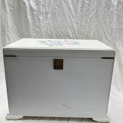 Sale Photo Thumbnail #234: Thomas Pacomi designer, 15X11 with 4 drawers and a lift off lid. Very heavy , with hand painted floral design in good condition. The drawers are divided for all kinds of jewelry. There is one repair photoed, to the edge of one of the drawers.