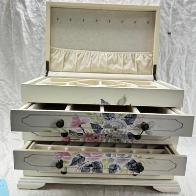 Sale Photo Thumbnail #224: Thomas Pacomi designer, 15X11 with 4 drawers and a lift off lid. Very heavy , with hand painted floral design in good condition. The drawers are divided for all kinds of jewelry. There is one repair photoed, to the edge of one of the drawers.