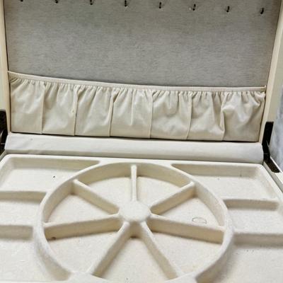 Sale Photo Thumbnail #225: Thomas Pacomi designer, 15X11 with 4 drawers and a lift off lid. Very heavy , with hand painted floral design in good condition. The drawers are divided for all kinds of jewelry. There is one repair photoed, to the edge of one of the drawers.