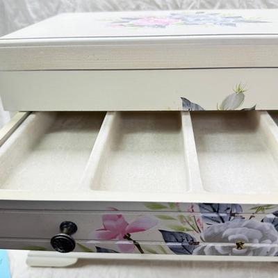 Sale Photo Thumbnail #223: Thomas Pacomi designer, 15X11 with 4 drawers and a lift off lid. Very heavy , with hand painted floral design in good condition. The drawers are divided for all kinds of jewelry. There is one repair photoed, to the edge of one of the drawers.