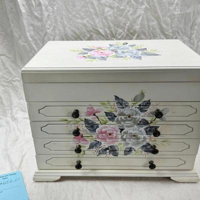 Sale Photo Thumbnail #221: Thomas Pacomi designer, 15X11 with 4 drawers and a lift off lid. Very heavy , with hand painted floral design in good condition. The drawers are divided for all kinds of jewelry. There is one repair photoed, to the edge of one of the drawers.