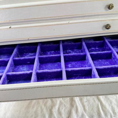 Sale Photo Thumbnail #241: Lined with purple material this "leatherette" box has divided drawers and is in good condition except for one small nick to one of the drawer fronts and a few areas of discoloration which I have not tried to clean. Measures 10X10X9"