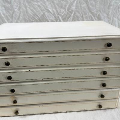 Sale Photo Thumbnail #237: Lined with purple material this "leatherette" box has divided drawers and is in good condition except for one small nick to one of the drawer fronts and a few areas of discoloration which I have not tried to clean. Measures 10X10X9"