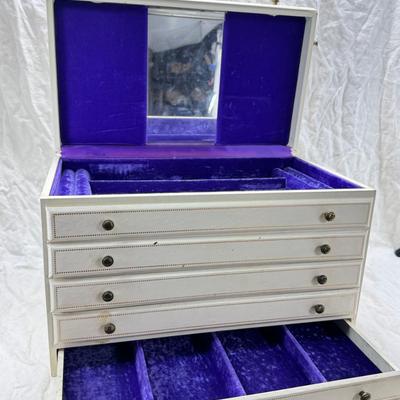 Sale Photo Thumbnail #243: Lined with purple material this "leatherette" box has divided drawers and is in good condition except for one small nick to one of the drawer fronts and a few areas of discoloration which I have not tried to clean. Measures 10X10X9"
