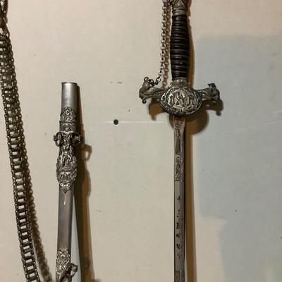 Sale Photo Thumbnail #231: This is great vintage sword.  FCB Knight with an etched  blasé and great details.