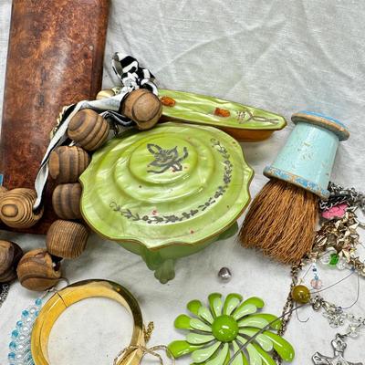 Sale Photo Thumbnail #301: Victorian vanity items, mirror, celluloid brush, shaving brush, early plastic containers. Beads, chains, Jewelry, necklaces, pins, bracelets, there are some strands that might need repair, there is a bag of extra beads, single earrings and of course a bag