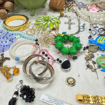 Sale Photo Thumbnail #304: Victorian vanity items, mirror, celluloid brush, shaving brush, early plastic containers. Beads, chains, Jewelry, necklaces, pins, bracelets, there are some strands that might need repair, there is a bag of extra beads, single earrings and of course a bag