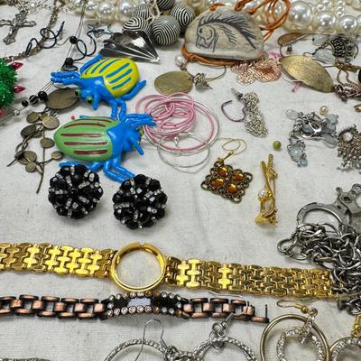 Sale Photo Thumbnail #305: Victorian vanity items, mirror, celluloid brush, shaving brush, early plastic containers. Beads, chains, Jewelry, necklaces, pins, bracelets, there are some strands that might need repair, there is a bag of extra beads, single earrings and of course a bag