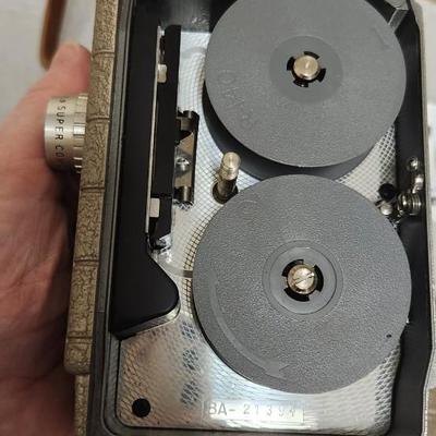 Sale Photo Thumbnail #64: Metal Bell and Howell one nine camera in case with light attachment. Fit a medium flat rate box