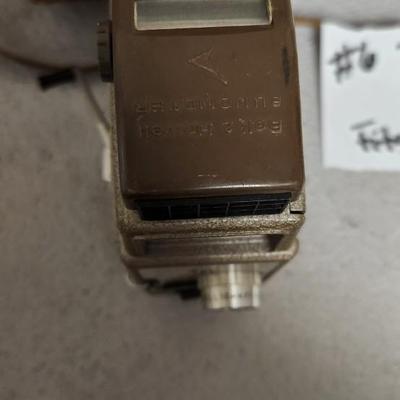 Sale Photo Thumbnail #67: Metal Bell and Howell one nine camera in case with light attachment. Fit a medium flat rate box