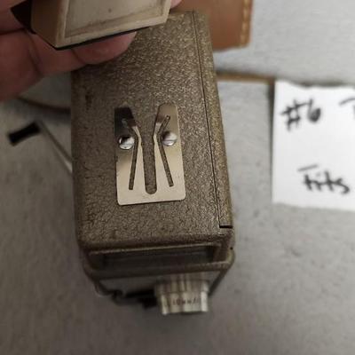 Sale Photo Thumbnail #68: Metal Bell and Howell one nine camera in case with light attachment. Fit a medium flat rate box