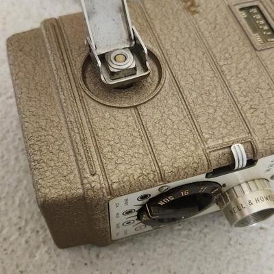 Sale Photo Thumbnail #66: Metal Bell and Howell one nine camera in case with light attachment. Fit a medium flat rate box