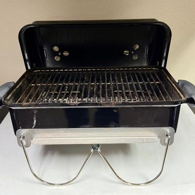 Sale Photo Thumbnail #399: This compact and lightweight grill is designed for easy transport and is suitable for camping, tailgating, and small outdoor spaces. Used, but in very clean, near-new condition.