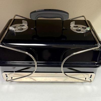 Sale Photo Thumbnail #397: This compact and lightweight grill is designed for easy transport and is suitable for camping, tailgating, and small outdoor spaces. Used, but in very clean, near-new condition.