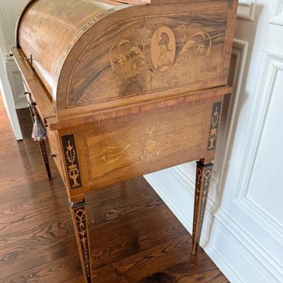Sale Photo Thumbnail #20: 20th Century Antique Italian Walnut Rosewood & Marquetry Cylinder Bureau Writing Desk. Decorated borders, the fall with oval figural roundel and enclosing a fitted interior with sliding writing surface and 4 drawers. 5 drawers about the arched kneehole wi