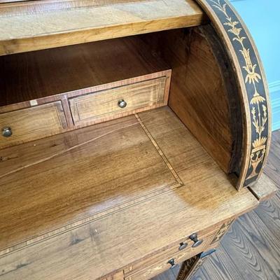 Sale Photo Thumbnail #23: 20th Century Antique Italian Walnut Rosewood & Marquetry Cylinder Bureau Writing Desk. Decorated borders, the fall with oval figural roundel and enclosing a fitted interior with sliding writing surface and 4 drawers. 5 drawers about the arched kneehole wi