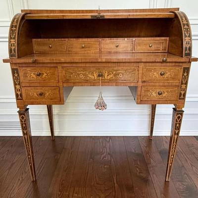 Sale Photo Thumbnail #19: 20th Century Antique Italian Walnut Rosewood & Marquetry Cylinder Bureau Writing Desk. Decorated borders, the fall with oval figural roundel and enclosing a fitted interior with sliding writing surface and 4 drawers. 5 drawers about the arched kneehole wi