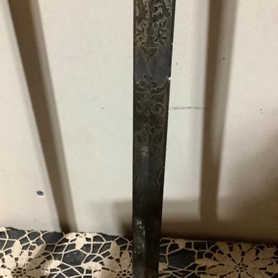 Sale Photo Thumbnail #225: This is a great religious sword with etched s blade and cross.