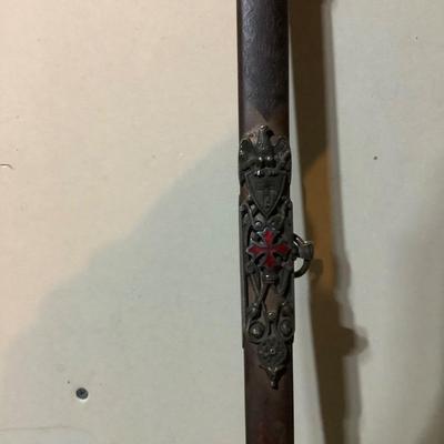 Sale Photo Thumbnail #214: This is a great religious sword with etched s blade and cross.