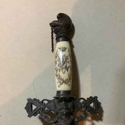 Sale Photo Thumbnail #212: This is a great religious sword with etched s blade and cross.