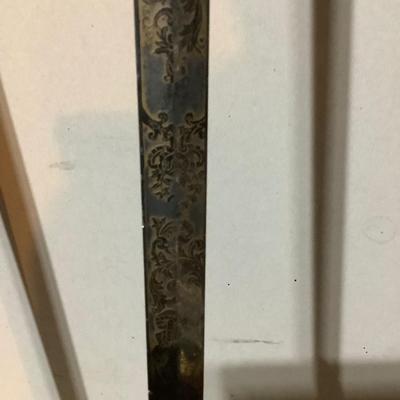 Sale Photo Thumbnail #221: This is a great religious sword with etched s blade and cross.