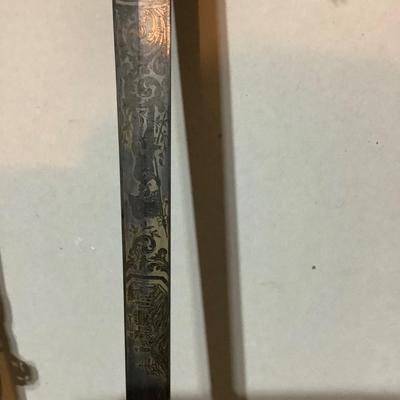 Sale Photo Thumbnail #223: This is a great religious sword with etched s blade and cross.