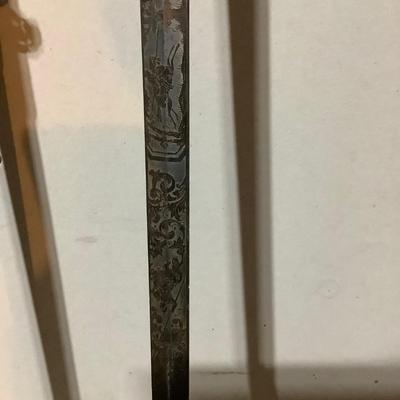 Sale Photo Thumbnail #224: This is a great religious sword with etched s blade and cross.