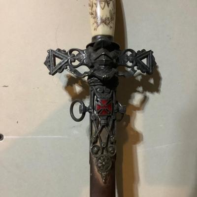 Sale Photo Thumbnail #213: This is a great religious sword with etched s blade and cross.