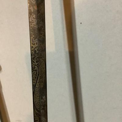 Sale Photo Thumbnail #220: This is a great religious sword with etched s blade and cross.