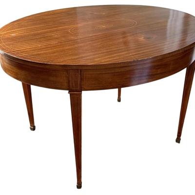 Sale Photo Thumbnail #47: Antique American Federal Neoclassical Oval Inlay Wood Dining Banquet Table  48" x 38.5" x 30"
Has some signs of use on top with scratch marks. Metal feet have marks/tarnish