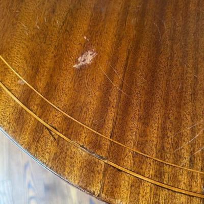 Sale Photo Thumbnail #50: Antique American Federal Neoclassical Oval Inlay Wood Dining Banquet Table  48" x 38.5" x 30"
Has some signs of use on top with scratch marks. Metal feet have marks/tarnish