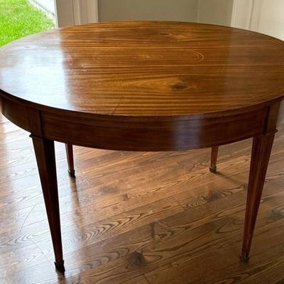 Sale Photo Thumbnail #48: Antique American Federal Neoclassical Oval Inlay Wood Dining Banquet Table  48" x 38.5" x 30"
Has some signs of use on top with scratch marks. Metal feet have marks/tarnish