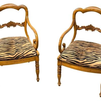 Sale Photo Thumbnail #70: Pair of Antique Karl Johan Biedermeier Style Tiger Print Animal Hide Wood Arm Chairs  19" x 19" x 33.5" Each
Antique chairs in great condition with some scuff marks on the wood and light surface rubbing on the animal hide seat. Very sturdy.”