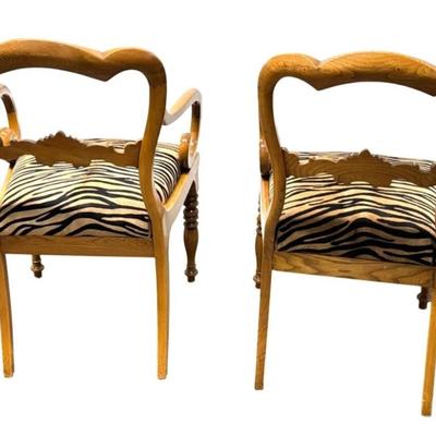 Sale Photo Thumbnail #72: Pair of Antique Karl Johan Biedermeier Style Tiger Print Animal Hide Wood Arm Chairs  19" x 19" x 33.5" Each
Antique chairs in great condition with some scuff marks on the wood and light surface rubbing on the animal hide seat. Very sturdy.”