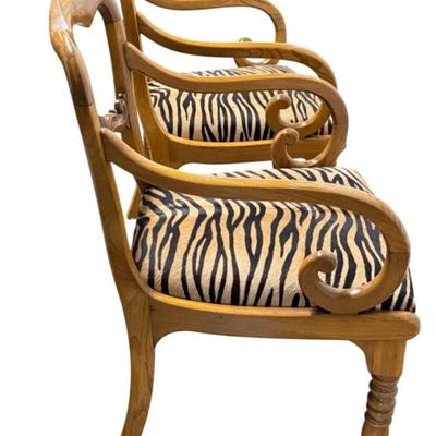 Sale Photo Thumbnail #71: Pair of Antique Karl Johan Biedermeier Style Tiger Print Animal Hide Wood Arm Chairs  19" x 19" x 33.5" Each
Antique chairs in great condition with some scuff marks on the wood and light surface rubbing on the animal hide seat. Very sturdy.”