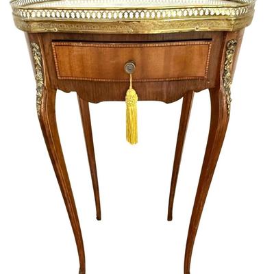 Sale Photo Thumbnail #73: Antique 19th C French Louis XV Style Marble Top Side Table w Brass Gallery, Ormolu Accents and Single Drawer.
Approximate Size: 17" x 12" x 30"

“General marks allover consistent with age and use. Some patina on metal.”