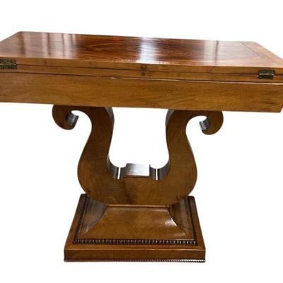 Sale Photo Thumbnail #86: Antique Empire Lyre Harp Base Flip Top Wood Game Card Accent Table
“Couple of scuffs on the base. A few very large scratches on the top including a zigzag. One that is "cracked" and extends under the table. Top is not "firm" and can move. It doesn't sit