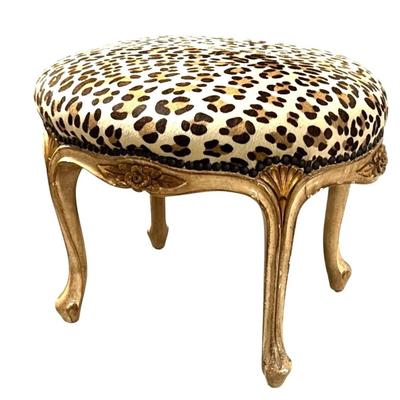 Sale Photo Thumbnail #116: Antique French Louis XVI Leopard Print Animal Hide Seat with metal studs and carved flower Ottoman Foot Stool Seat
Approximate Size: 17.5" x 14" x 15"
“In great condition with some rubbing in the animal hide seat on top. Some scuff marks in the paint al