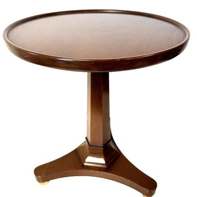 Sale Photo Thumbnail #137: Vintage Kittinger Furniture Buffalo Round Wood Pedestal Table Pattern T252 with Gold Ball Feet.
In good condition with some minor marks consistent with use. Top has a little bit of a rough grain in areas. Please see photos.
Approximately 14"x14"x17"