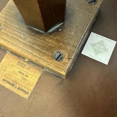 Sale Photo Thumbnail #140: Vintage Kittinger Furniture Buffalo Round Wood Pedestal Table Pattern T252 with Gold Ball Feet.
In good condition with some minor marks consistent with use. Top has a little bit of a rough grain in areas. Please see photos.
Approximately 14"x14"x17"