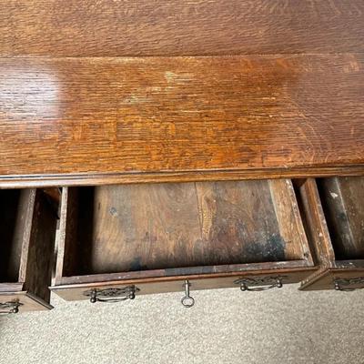 Sale Photo Thumbnail #176: Antique Oak Wood 3 Drawer Lowboy Dressing Table England Circa 1770  32" x 20" x 28"
In good antique condition with marks consistent with use especially on top. Crack in a drawer and divot in leg. Nice sturdy piece. Please see photos.