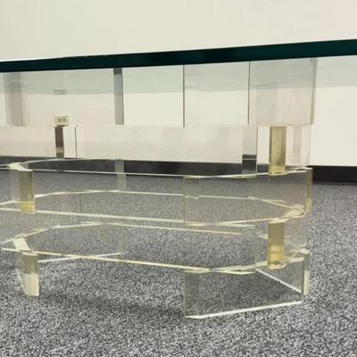 Sale Photo Thumbnail #181: Mid Century Modern Stacked Lucite Coffee Table with Glass Top.
“Uncertain if glass top is original to the piece. Some marks in the Lucite. Slight yellow tint to the Lucite and Slight green tint to the glass.
Approximate Measurements:
Glass with Base 54"
