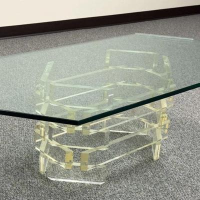 Sale Photo Thumbnail #179: Mid Century Modern Stacked Lucite Coffee Table with Glass Top.
“Uncertain if glass top is original to the piece. Some marks in the Lucite. Slight yellow tint to the Lucite and Slight green tint to the glass.
Approximate Measurements:
Glass with Base 54"