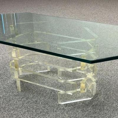 Sale Photo Thumbnail #180: Mid Century Modern Stacked Lucite Coffee Table with Glass Top.
“Uncertain if glass top is original to the piece. Some marks in the Lucite. Slight yellow tint to the Lucite and Slight green tint to the glass.
Approximate Measurements:
Glass with Base 54"