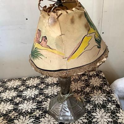 Sale Photo Thumbnail #97: This is a great pop metal table lamp with child’s western scene lamp shade.  Lamp shade has damage. Has newer cord